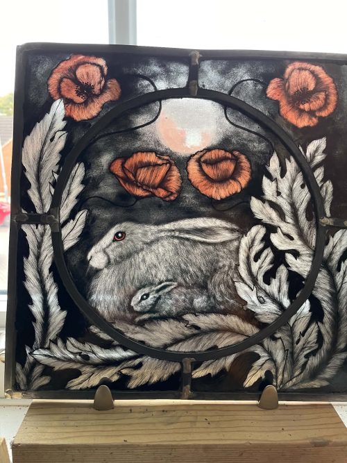 amongst the poppies (hare with babies) stained glass panel by artist christine saunders amber dragons