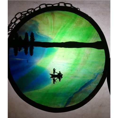 tribute to aurora borealis over lake and boat in stained glass by christine saunders of amber dragons