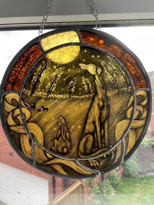 moongazing-friends, greyhound and hare under a moon in stained glass by artist christine saunders of amber dragons