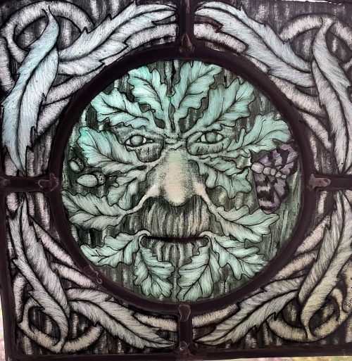 small oak green man stained glass panel