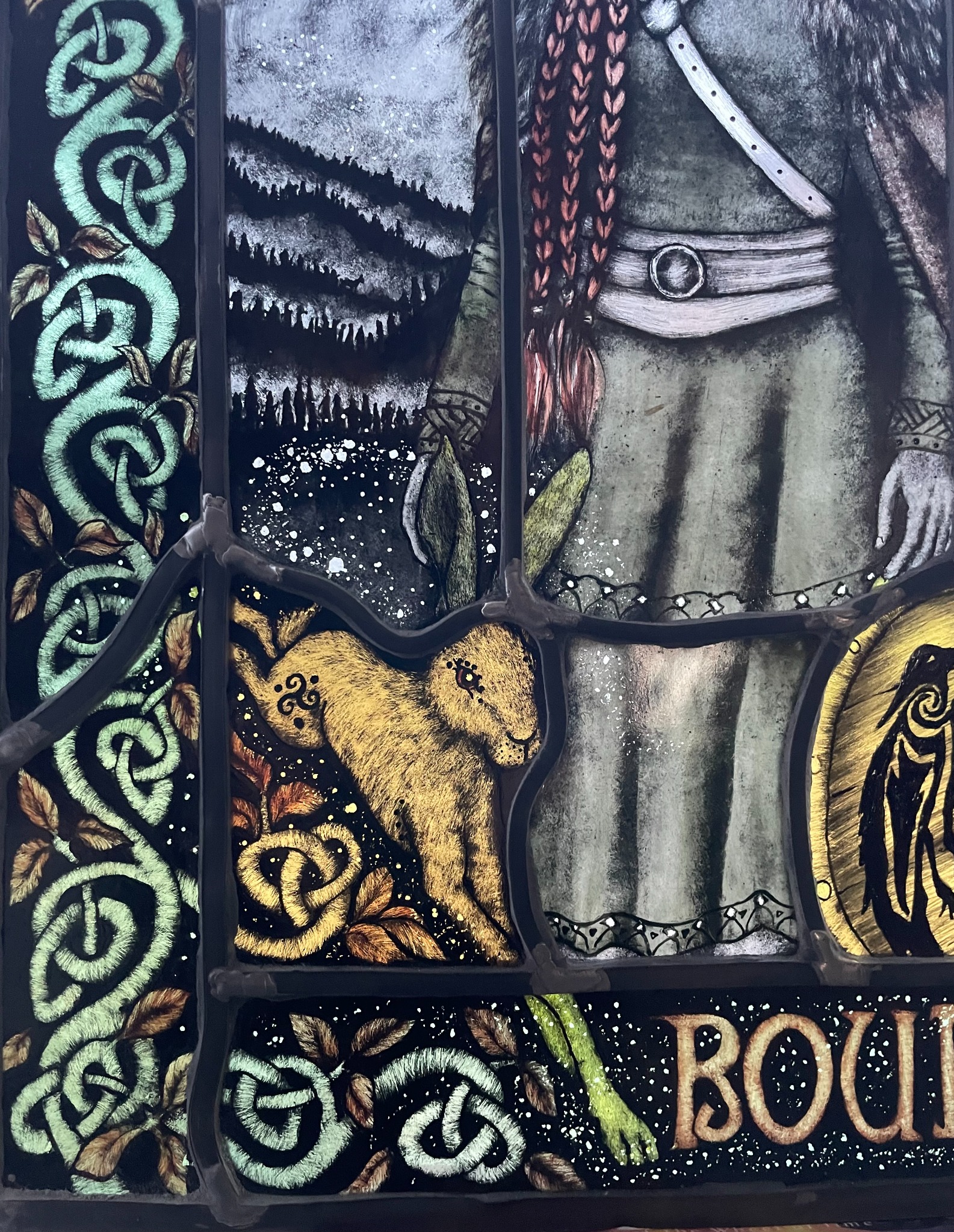 Boudica stained glass artwork by Christine Saunders showing the portrait, hare and Celtic-inspired decoration